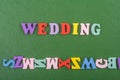 WEDDING word on green background composed from colorful abc alphabet block wooden letters, copy space for ad text. Learning Royalty Free Stock Photo