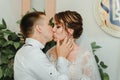 Wedding: young couple in love bride and groom hugging each other holding a bouquet of flowers. Two lovers hearts on the Royalty Free Stock Photo