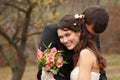 Wedding, young groom kiss bride in love over autumn nature backg