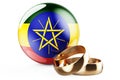 Weddings in Ethiopia concept. Wedding rings with Ethiopian flag. 3D rendering Royalty Free Stock Photo