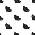 Wedge booties icon in black style isolated on white background. Shoes pattern stock vector illustration.