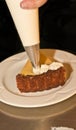 Wedge of freshly baked key lime pie and piping whipped cream Royalty Free Stock Photo