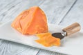 Mimolette cheese on white plate