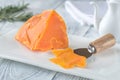 Mimolette cheese on white plate