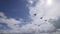 Wedge planes fly on the background of the sky Air plane flies in the blue sky above the clouds 3d Royalty Free Stock Photo