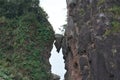 A wedge-shaped rock between two giant rocks or Benkei no Hasamiiwa at Sado island, Japan