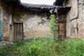 Weedy yard of ruined Chinese dwelling house Royalty Free Stock Photo