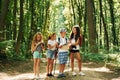 Weekend activies. Kids strolling in the forest with travel equipment Royalty Free Stock Photo