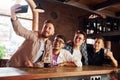 Weekend activities. People in casual clothes sitting in the pub