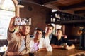 Weekend activities. People in casual clothes sitting in the pub