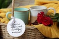 Weekend card and greeting text message on tag label paper - Have a relax and beautiful weekend. With couple cups of tea or coffee.