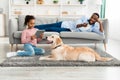 Black family and dog spending time together at home Royalty Free Stock Photo