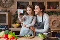 Weekend With Daddy. Cheerful Father And Little Daughter Taking Selfie In Kitchen