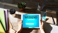 Weekend loading status bar message on device screen. Royalty Free Stock Photo