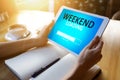 Weekend loading status bar message on device screen. Royalty Free Stock Photo