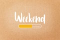 WEEKEND loading text on brown paper background Royalty Free Stock Photo