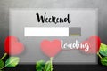 Weekend is loading... words on red heart flowers. Royalty Free Stock Photo