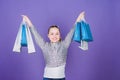 Weekend sale. Happy child. Little girl with gifts. Small girl with shopping bags. Kid fashion. shop assistant with Royalty Free Stock Photo