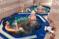 Lazy weekend for Couple. Relaxing in jacuzzi at health spa stock photo Royalty Free Stock Photo