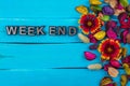 Weekend word on blue wood with flower Royalty Free Stock Photo