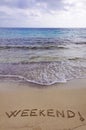 Weekend ! written in sand, on a beautiful beach Royalty Free Stock Photo