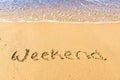 Weekend written on sand Royalty Free Stock Photo