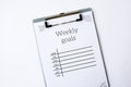 Weekly goals planner on white background. Planning week to stay productive when working from home during quarantine period