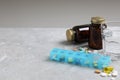 Weekly pill box with medicaments and glass of water on grey marble table. Space for text Royalty Free Stock Photo