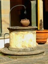 Weel and pots in ancient cloister Royalty Free Stock Photo