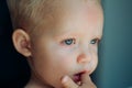 These weepy eyes. Little boy child with sad face. He is a cry baby. Little baby crying. Baby with tear rolling down his Royalty Free Stock Photo