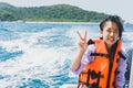 Weet Asian girl feel exhausted sitting on speed boat after hour