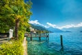 Village Weggis, lake Lucerne Vierwaldstatersee, Rigi mountain and Swiss Alps in the background near famous Lucerne Luzern city Royalty Free Stock Photo
