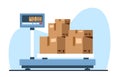Weighing cardboard boxes with load on floor electronic scale. Warehouse equipment for measurement, delivery storage and
