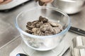 Weighing chocolate chips on a bowl Royalty Free Stock Photo