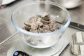 Weighing chocolate chips on a bowl Royalty Free Stock Photo