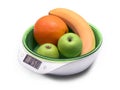 Weighing fruit for diet on electronic scales. isolated on white Royalty Free Stock Photo