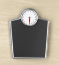 Weighing scale on wooden floor Royalty Free Stock Photo