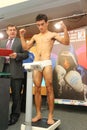 Weighing underwear boxer on press conference Royalty Free Stock Photo
