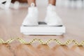 Closeup Black Woman Standing On Scales, Focus On Measure Tape Royalty Free Stock Photo