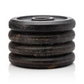 Weight discs in stack on white background