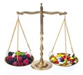 Weight of fruits and medicines Royalty Free Stock Photo