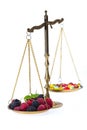 Weight of fruits and medicines Royalty Free Stock Photo