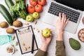 Female hands writing in the notepad words meal plan top view flat lay Royalty Free Stock Photo