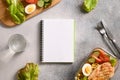 Weight loss concept, calories counting, diet, food control and calorie counter, diet plan. Notebook, food, salad, egg Royalty Free Stock Photo