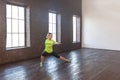 Weight loss concept. Seriously woman doing gymnastics indoor Royalty Free Stock Photo