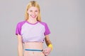 Weight loss. Fitness and health. Female slim waist belly and tape measure. Athlete fitness coach training. Trying to Royalty Free Stock Photo