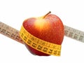 Weight loss and healthy dieting concept red apple measuring tape isolated Royalty Free Stock Photo