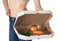 Weight loss and healthy eating or dieting concept. Slim girl with open pizza box and raw vegetables in it.
