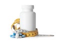 Weight loss pills and bottle with measuring tape Royalty Free Stock Photo