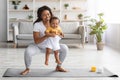 Weight Loss After Pregnancy. Black Mom Training At Home With Infant Baby